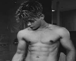He works hard at gym to maintain his abs.